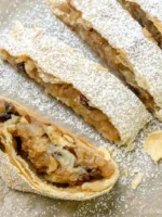 Austrian Apple Strudel Slice (Apfelstrudel) - Authentic pastry with flaky layers, filled with apples, raisins, and cinnamon