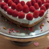 Creamy Raspberry Heart 08 This Picture Shows The Creamy Raspberry Heart Cake 08 From Front With Sprinkles On Plate