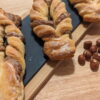 This Picture Shows 3X Light Hazelnut Bow On A Wooden Plate Zoomed In