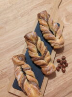 This picture shows 3x light hazelnut bow on a wooden plate