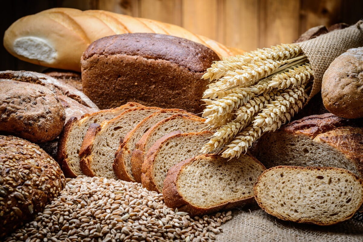 bread category image showing Assorted German bread varieties on display, including pretzels, rye bread, and wheat rolls.