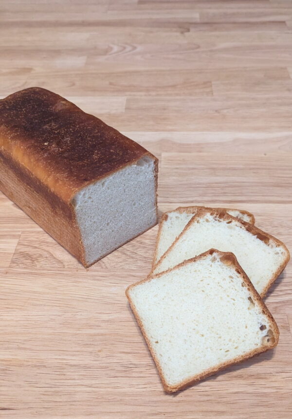 breakfast butter toast 02 A Loaf Of Bread And Slices Of Bread On A Wooden Surface