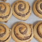 This image shows multiple hazelnut swirls on a baking tray