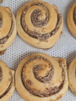 This image shows multiple hazelnut swirls on a baking tray