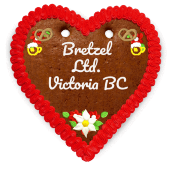 Festive Oktoberfest Love Hearts gingerbread cookies with colorful icing and customizable inscriptions.