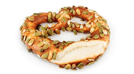 Bretzel Sunflower – a glossy Bavarian pretzel topped with roasted sunflower seeds, baked with real butter