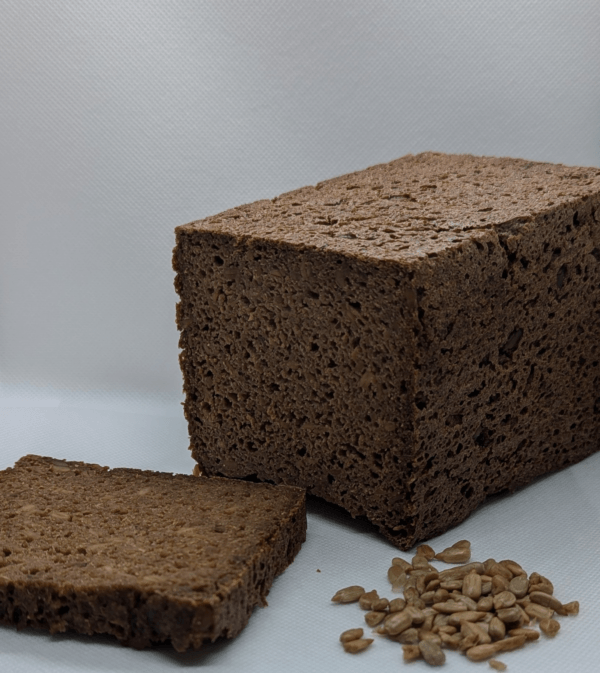 pumpernickel Artisan German Pumpernickel Bread Made With 100 % Rye Sourdough And Sunflower Seeds, Rich Dark Crust And Dense, Hearty Texture.